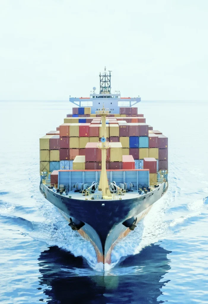 Container ship carrying cargo containers for international shipping and export services.